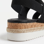 Mallow — Crossed elastic straps, esparto base, and comfortable platform