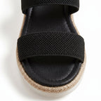 Mallow — Crossed elastic straps, esparto base, and comfortable platform
