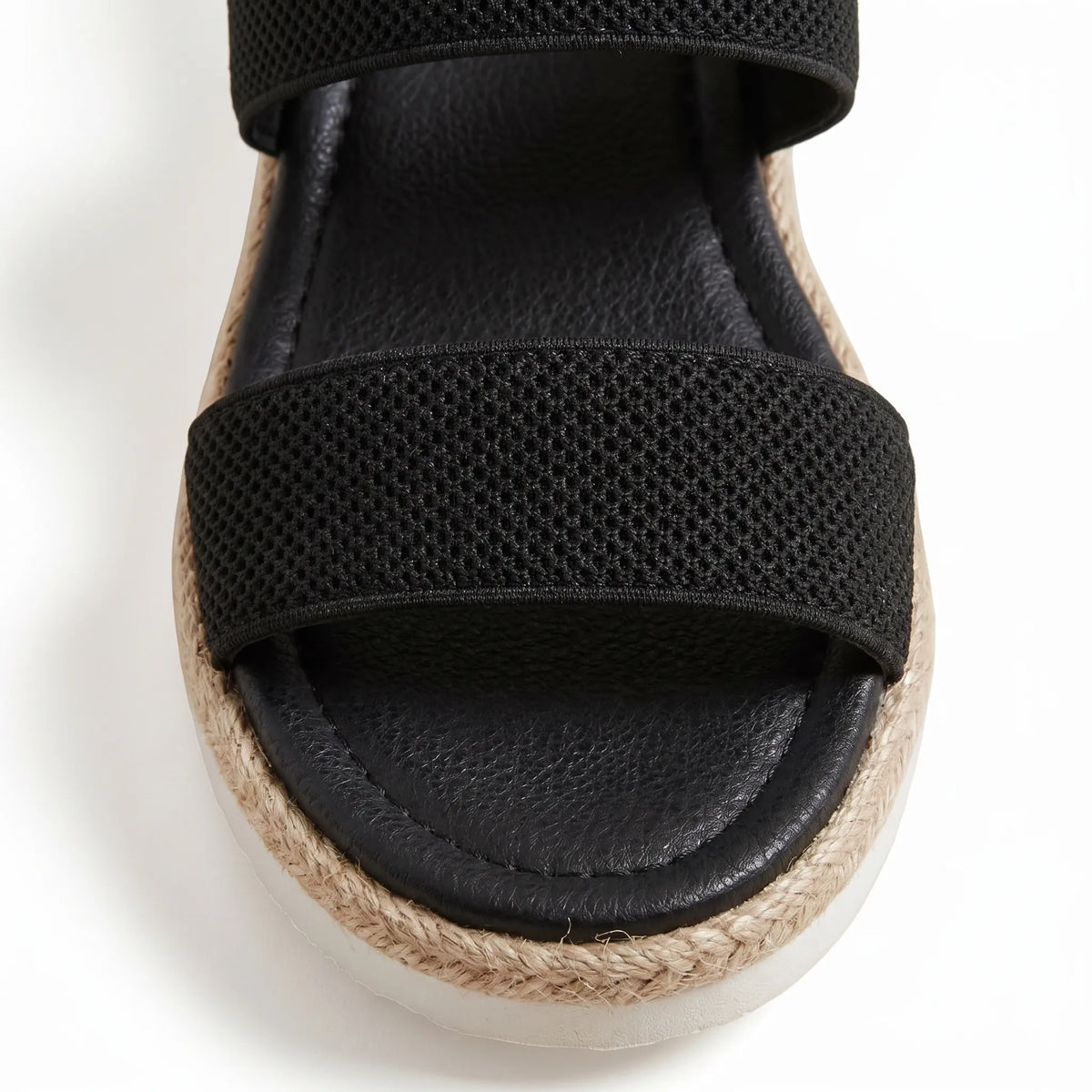 Mallow — Crossed elastic straps, esparto base, and comfortable platform