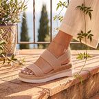 Mallow — Crossed elastic straps, esparto base, and comfortable platform